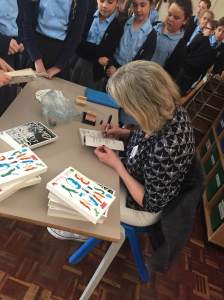 Busily signing books